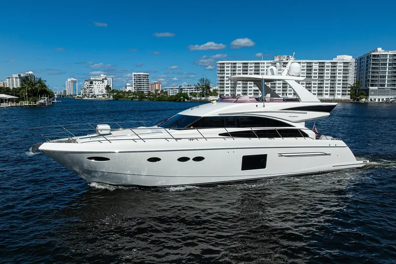 Tight Squeeze Yacht Photos Pics Luxurious 2016 Princess F64 yacht cruising on a sunny day with cityscape backdrop.