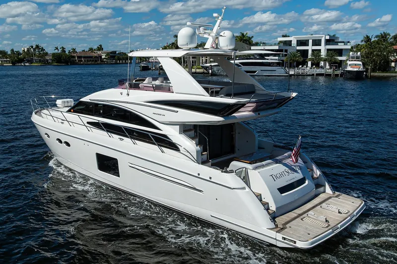 Tight Squeeze Yacht Photos Pics Luxurious 2016 Princess F64 yacht cruising on a sunny day with scenic waterfront views.