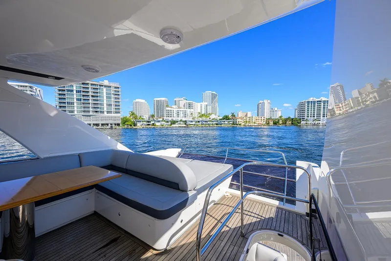 Tight Squeeze Yacht Photos Pics Luxurious 2016 Princess F64 yacht with city skyline and waterfront view.
