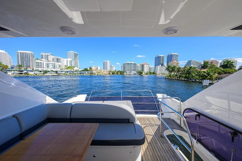 Tight Squeeze Yacht Photos Pics Luxurious 2016 Princess F64 yacht with city skyline and waterfront view.