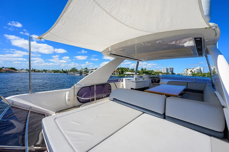 Tight Squeeze Yacht Photos Pics Luxurious 2016 Princess F64 yacht with spacious deck, scenic waterfront view.