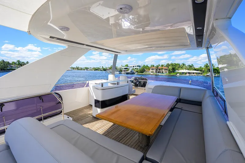 Tight Squeeze Yacht Photos Pics Luxurious 2016 Princess F64 yacht interior with spacious seating and scenic waterfront view.