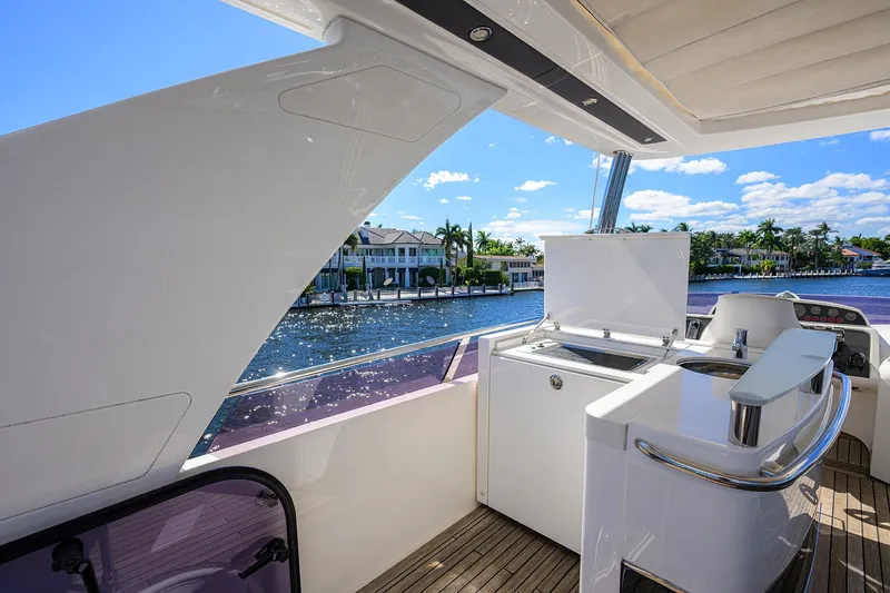 Tight Squeeze Yacht Photos Pics Luxury yacht Princess F64, 2016 model, featuring sleek deck design and waterfront view.