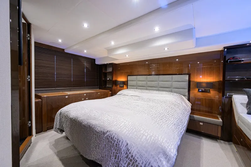Tight Squeeze Yacht Photos Pics Luxurious bedroom interior of 2016 Princess F64 yacht with modern design and ambient lighting.