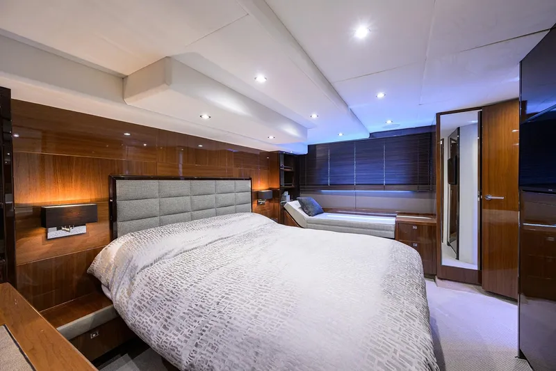 Tight Squeeze Yacht Photos Pics Luxurious bedroom interior of 2016 Princess F64 yacht with modern design and ambient lighting.