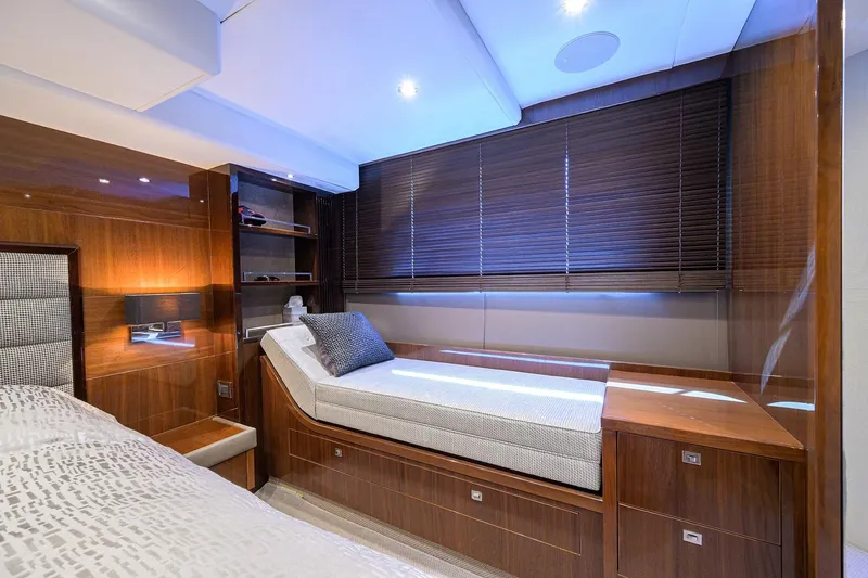 Tight Squeeze Yacht Photos Pics Luxurious cabin interior of 2016 Princess F64 yacht with elegant wood finishes.
