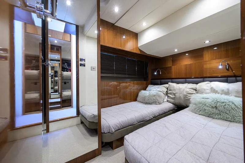 Tight Squeeze Yacht Photos Pics Luxurious 2016 Princess F64 yacht cabin with twin beds and elegant wood paneling.