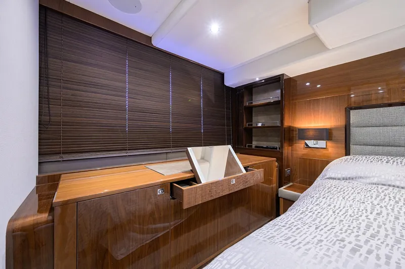 Tight Squeeze Yacht Photos Pics Luxurious cabin interior of 2016 Princess F64 yacht with wooden furnishings and modern design.