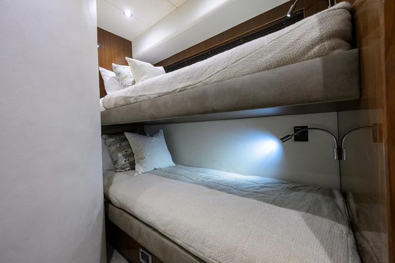 Tight Squeeze Yacht Photos Pics Bunk beds in 2016 Princess F64 yacht cabin with cozy lighting and plush bedding.