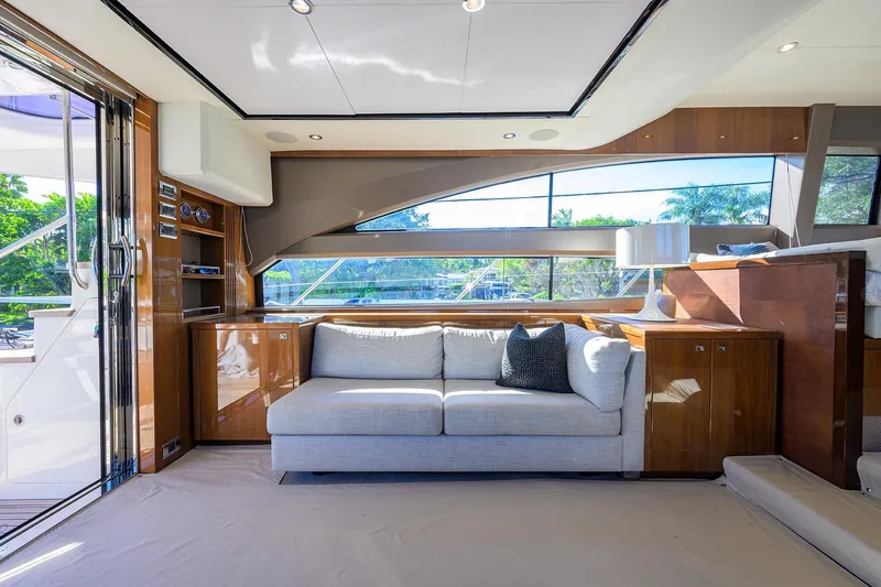 Tight Squeeze Yacht Photos Pics Luxurious interior of 2016 Princess F64 yacht with modern sofa and elegant decor.