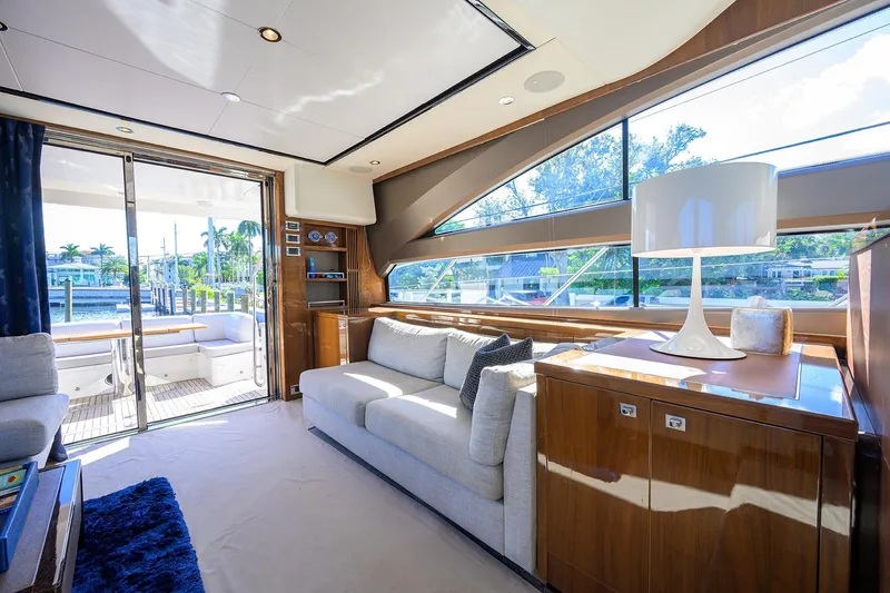 Tight Squeeze Yacht Photos Pics Luxurious interior of 2016 Princess F64 yacht with modern furnishings and large windows.