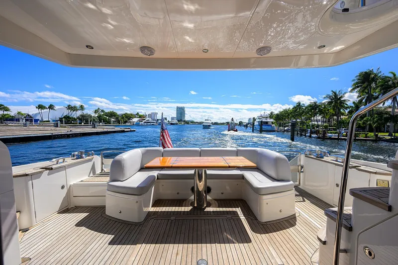 Tight Squeeze Yacht Photos Pics Luxurious 2016 Princess F64 yacht deck with waterfront view and elegant seating area.