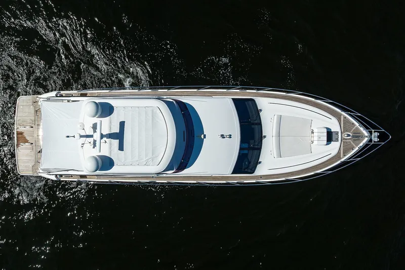 Tight Squeeze Yacht Photos Pics Aerial view of 2016 Princess F64 yacht on dark water.