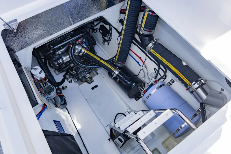 Mabinti Yacht Photos Pics Engine compartment of 2024 Leopard 40 Powercat, showcasing mechanical components and piping.