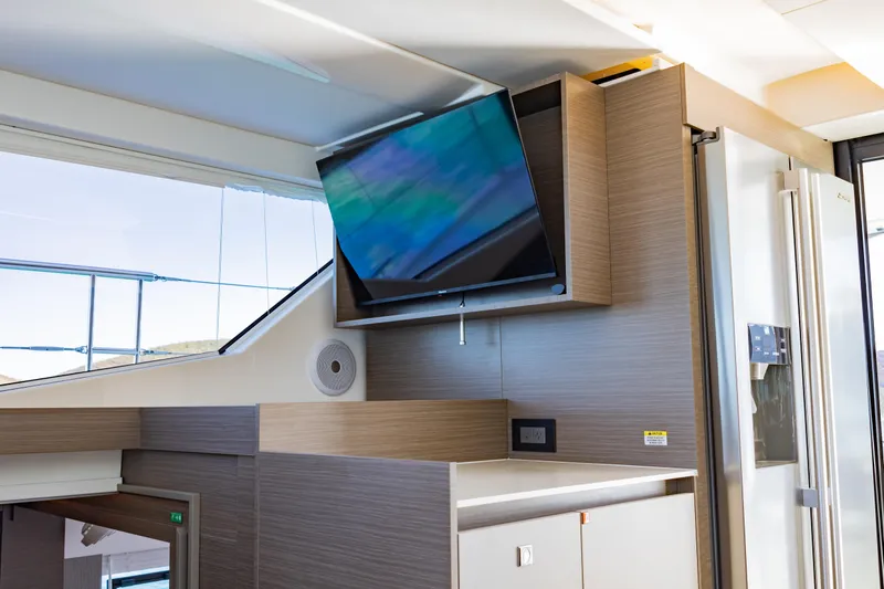 Mabinti Yacht Photos Pics Interior of 2024 Leopard 40 Powercat with mounted TV and modern cabinetry.