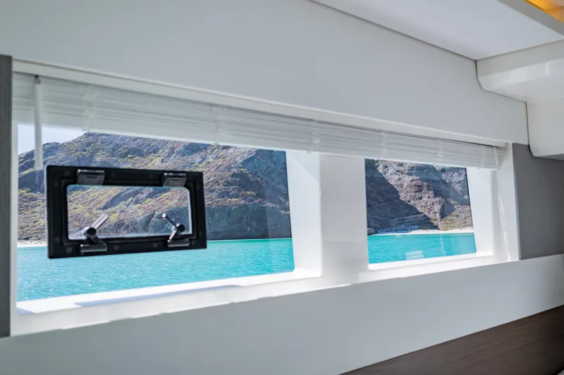 Mabinti Yacht Photos Pics Interior view from 2024 Leopard 40 Powercat, showcasing scenic ocean and mountain landscape.