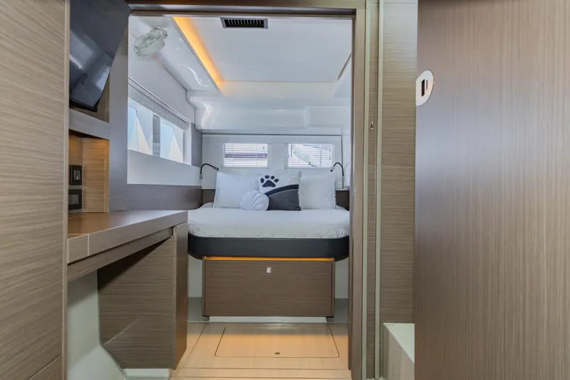 Mabinti Yacht Photos Pics 2024 Leopard 40 Powercat cabin interior with modern design and cozy bedding.