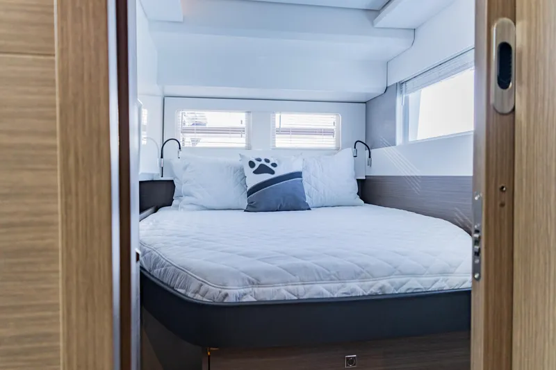 Mabinti Yacht Photos Pics 2024 Leopard 40 Powercat bedroom interior with cozy bed and modern design.