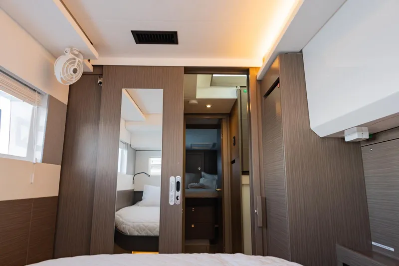 Mabinti Yacht Photos Pics Interior of 2024 Leopard 40 Powercat cabin with modern wood finish and cozy bed.