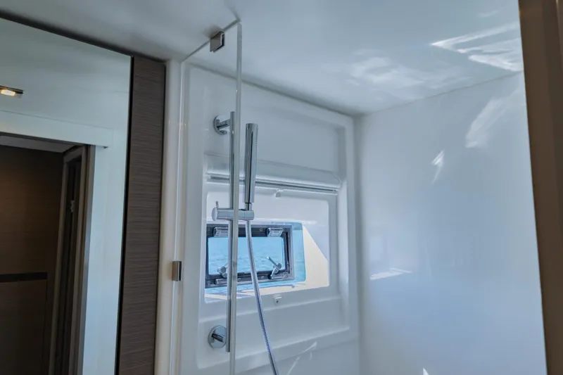 Mabinti Yacht Photos Pics Modern shower area in 2024 Leopard 40 Powercat with window and sleek fixtures.