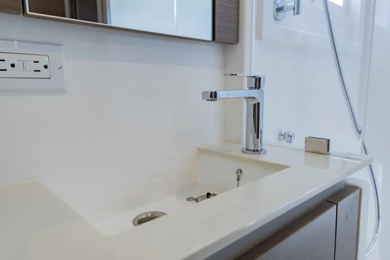 Mabinti Yacht Photos Pics Modern bathroom sink with chrome faucet on 2024 Leopard 40 Powercat yacht.