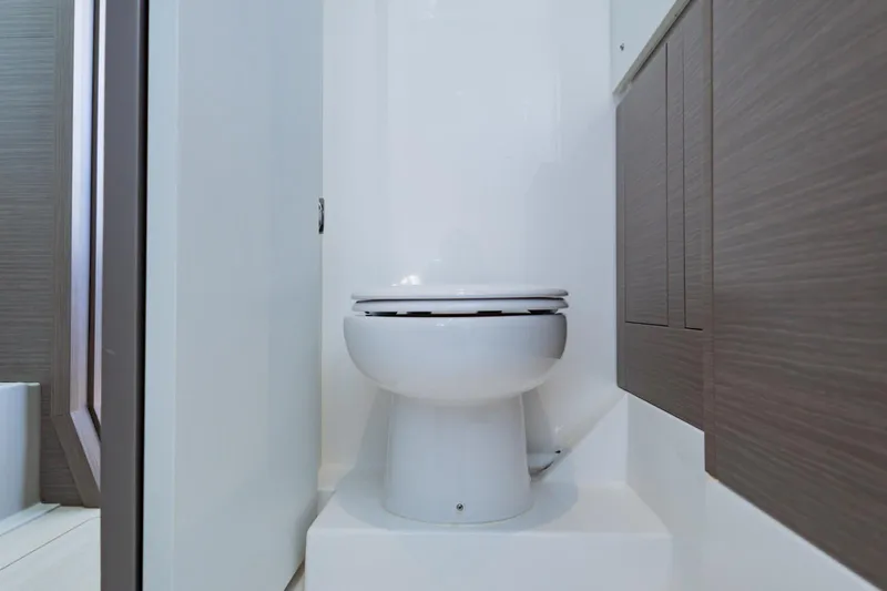 Mabinti Yacht Photos Pics 2024 Leopard 40 Powercat bathroom interior with modern toilet and sleek cabinetry.