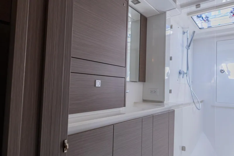 Mabinti Yacht Photos Pics Modern bathroom interior of 2024 Leopard 40 Powercat yacht with sleek cabinetry and shower.
