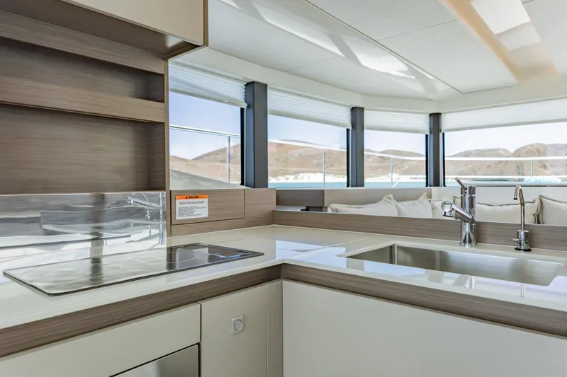 Mabinti Yacht Photos Pics Modern kitchen interior of 2024 Leopard 40 Powercat yacht with sleek design and panoramic windows.