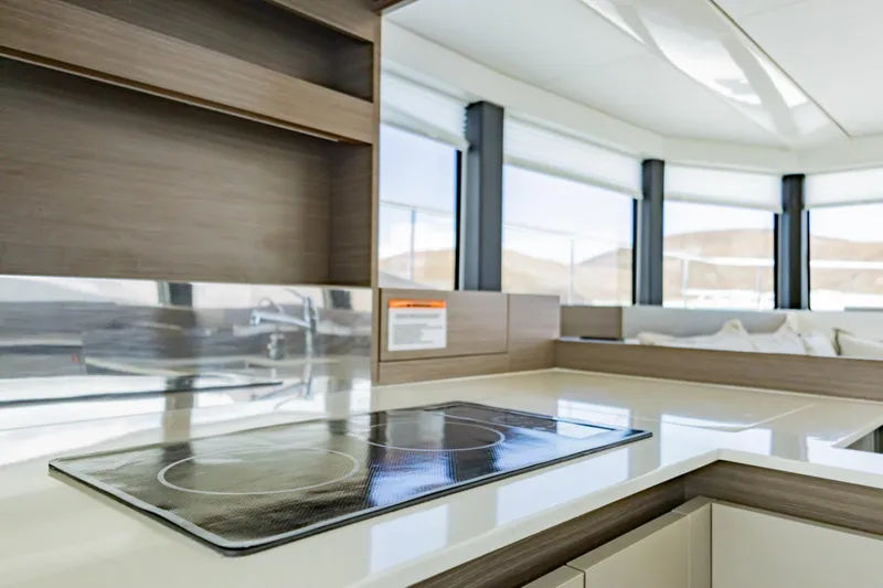 Mabinti Yacht Photos Pics Modern kitchen interior of 2024 Leopard 40 Powercat yacht with sleek design and panoramic windows.