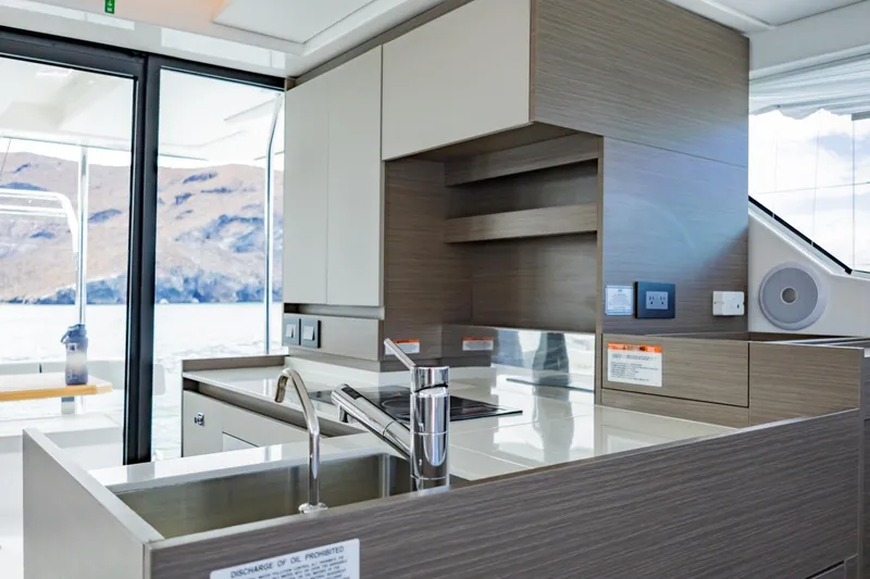 Mabinti Yacht Photos Pics Modern kitchen interior of 2024 Leopard 40 Powercat yacht with sleek design and ocean view.
