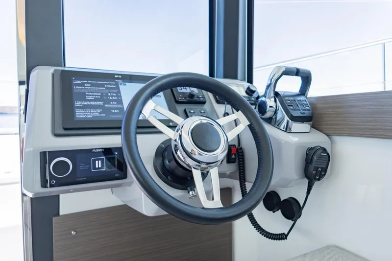 Mabinti Yacht Photos Pics Steering console of 2024 Leopard 40 Powercat with modern controls and navigation display.