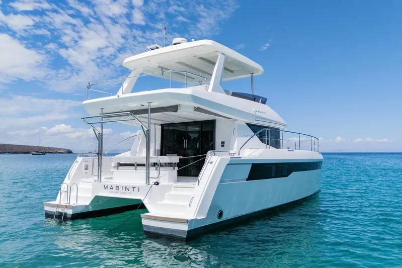 Mabinti Yacht Photos Pics 2024 Leopard 40 Powercat yacht on clear blue water under a bright sky.