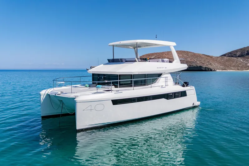 Mabinti Yacht Photos Pics 2024 Leopard 40 Powercat yacht on clear blue water, showcasing sleek design and modern features.