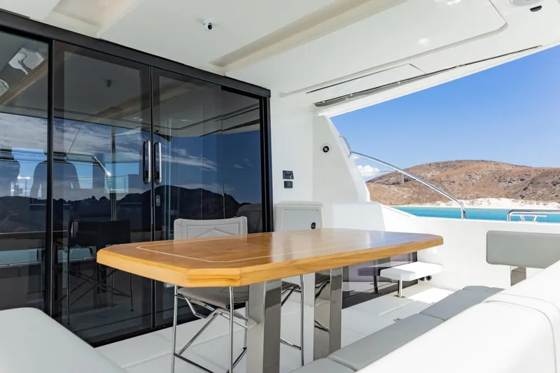 Mabinti Yacht Photos Pics 2024 Leopard 40 Powercat yacht interior with elegant dining area and scenic ocean view.