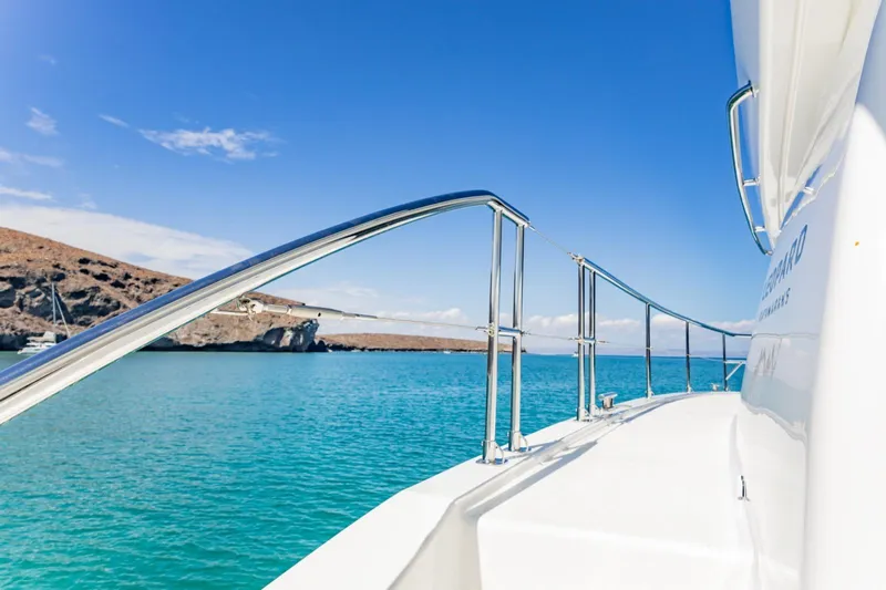 Mabinti Yacht Photos Pics 2024 Leopard 40 Powercat cruising in clear blue waters under a sunny sky.