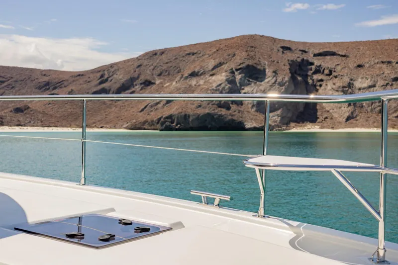 Mabinti Yacht Photos Pics 2024 Leopard 40 Powercat yacht deck with scenic coastal view.