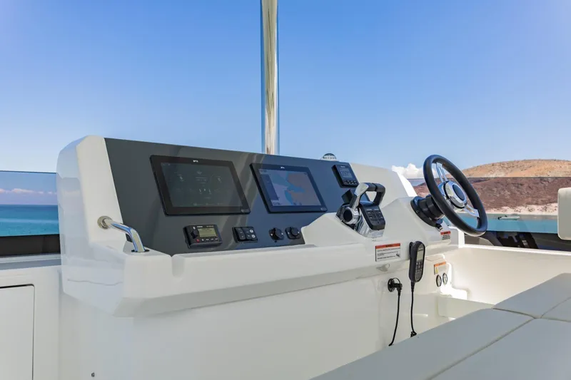 Mabinti Yacht Photos Pics 2024 Leopard 40 Powercat helm with modern navigation controls and ocean view.