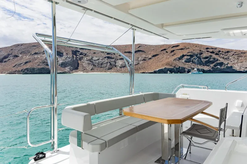 Mabinti Yacht Photos Pics 2024 Leopard 40 Powercat yacht with scenic ocean view and comfortable seating area.