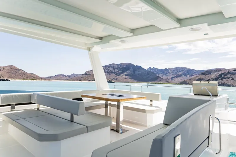 Mabinti Yacht Photos Pics 2024 Leopard 40 Powercat yacht interior with scenic ocean and mountain views.