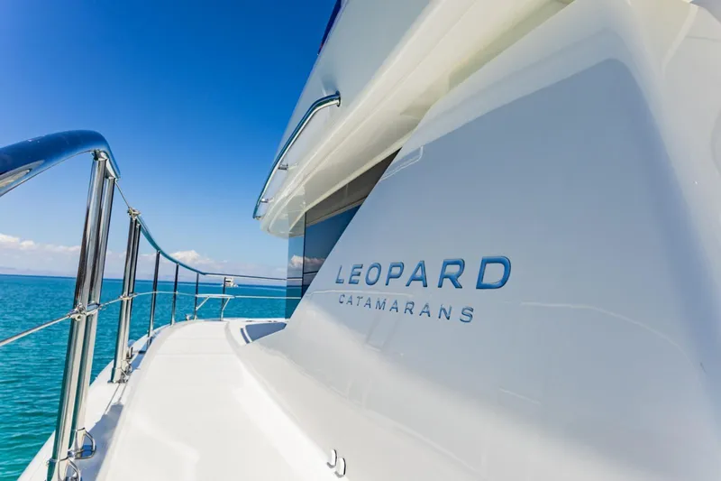Mabinti Yacht Photos Pics 2024 Leopard 40 Powercat yacht on clear blue water, showcasing sleek design.