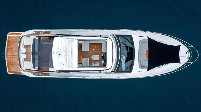  Yacht Photos Pics Top view of 2026 Fairline Squadron 68 luxury yacht on blue water.