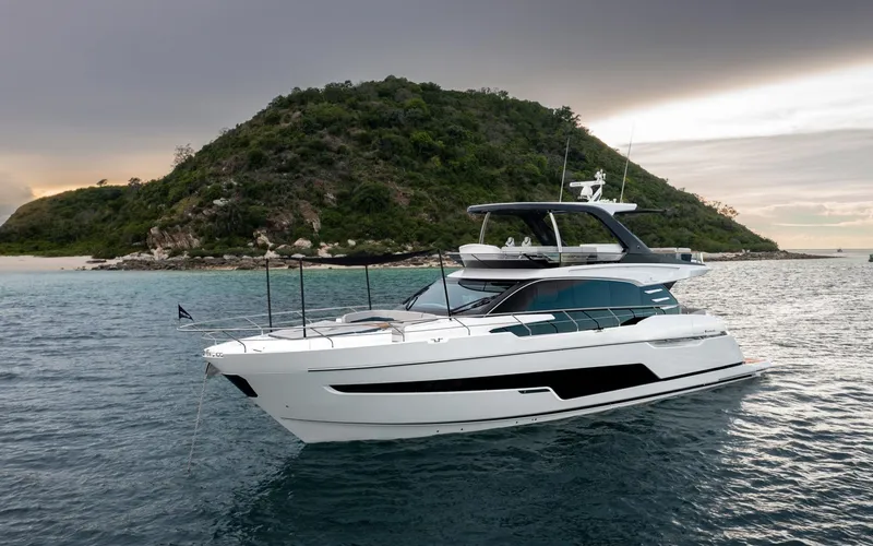  Yacht Photos Pics Luxury Fairline Squadron 68 yacht cruising near a scenic island, 2026 model.