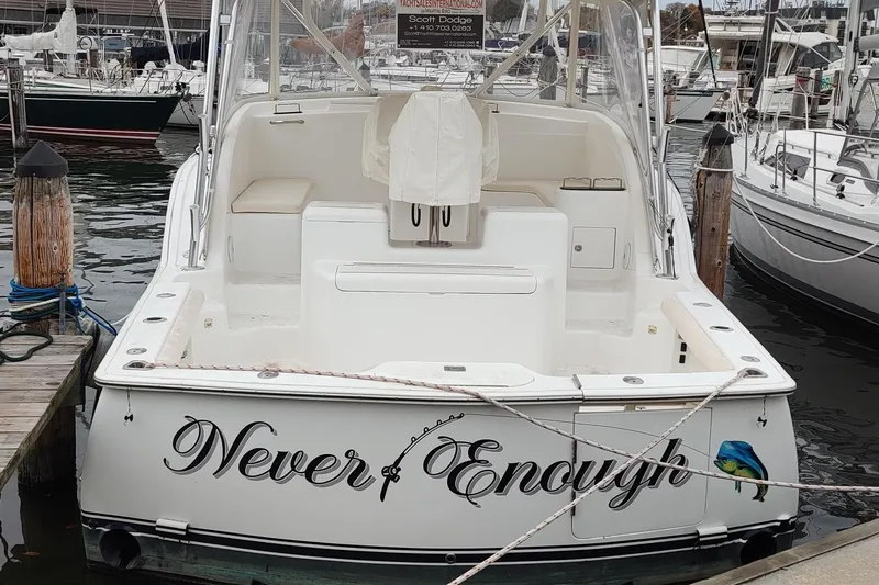 Never Enough Yacht Photos Pics 2017 Out Island SeaTek 36 Express boat named "Never Enough" docked at a marina.