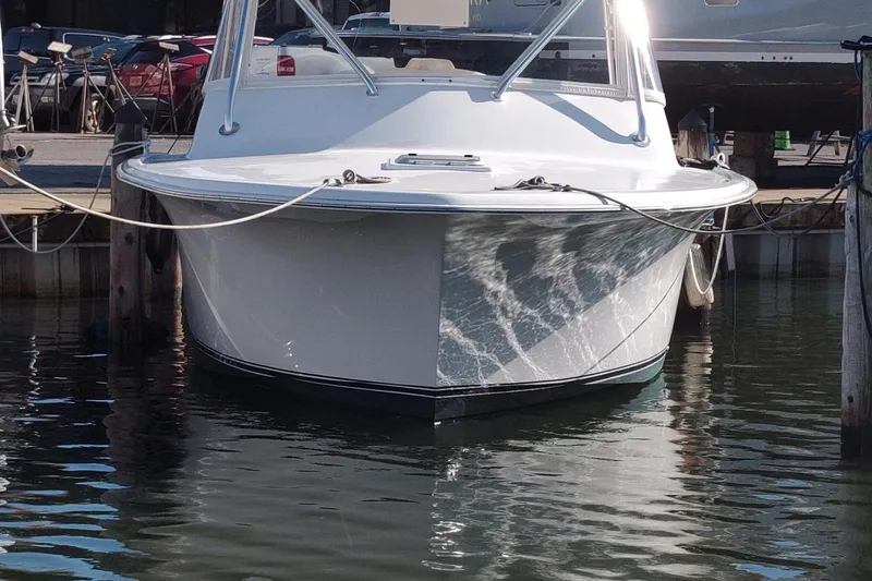 Never Enough Yacht Photos Pics 2017 Out Island SeaTek 36 Express boat docked in marina, front view.