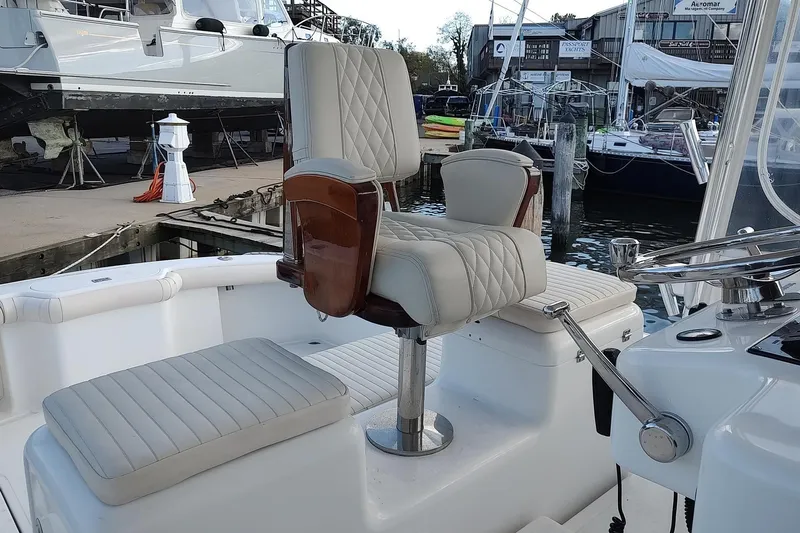 Never Enough Yacht Photos Pics Luxury seating on 2017 Out Island SeaTek 36 Express boat at marina.