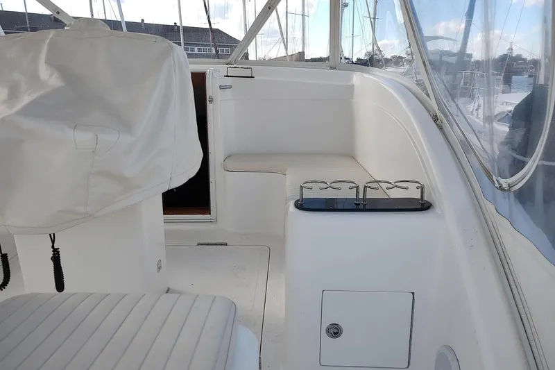 Never Enough Yacht Photos Pics 2017 Out Island SeaTek 36 Express boat interior with seating and cup holders.