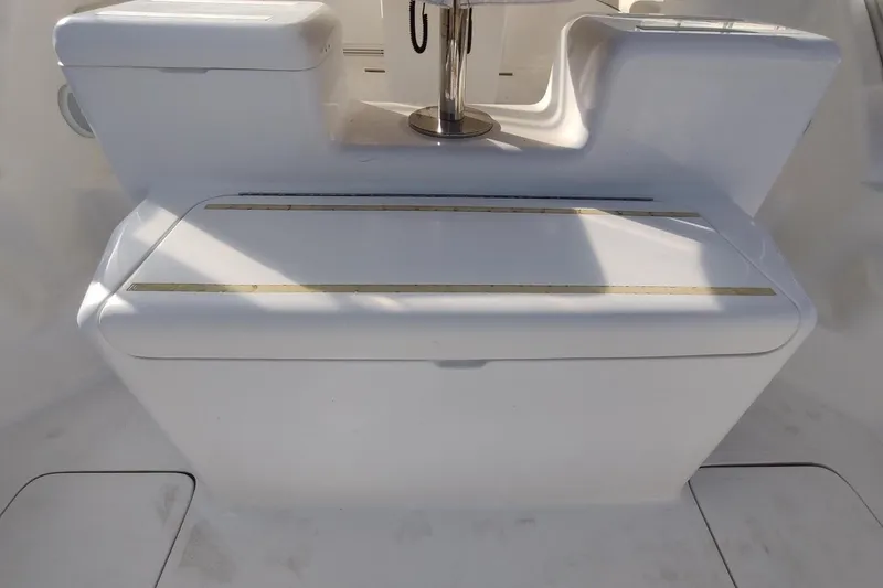 Never Enough Yacht Photos Pics 2017 Out Island SeaTek 36 Express boat seating area with storage compartment.