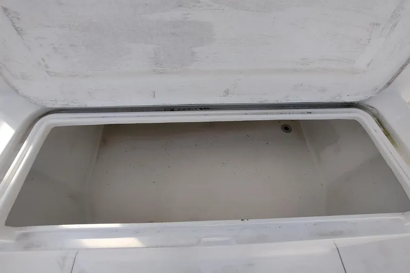 Never Enough Yacht Photos Pics Open storage compartment on 2017 Out Island SeaTek 36 Express boat.