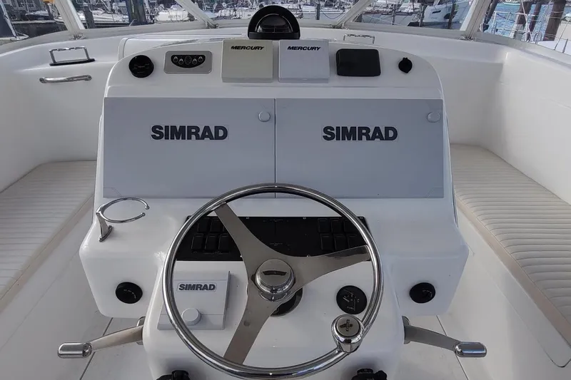 Never Enough Yacht Photos Pics Helm of 2017 Out Island SeaTek 36 Express with Simrad navigation system.