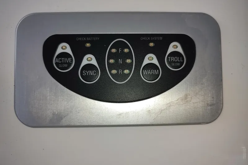 Never Enough Yacht Photos Pics Control panel of 2017 Out Island SeaTek 36 Express boat with various function buttons.